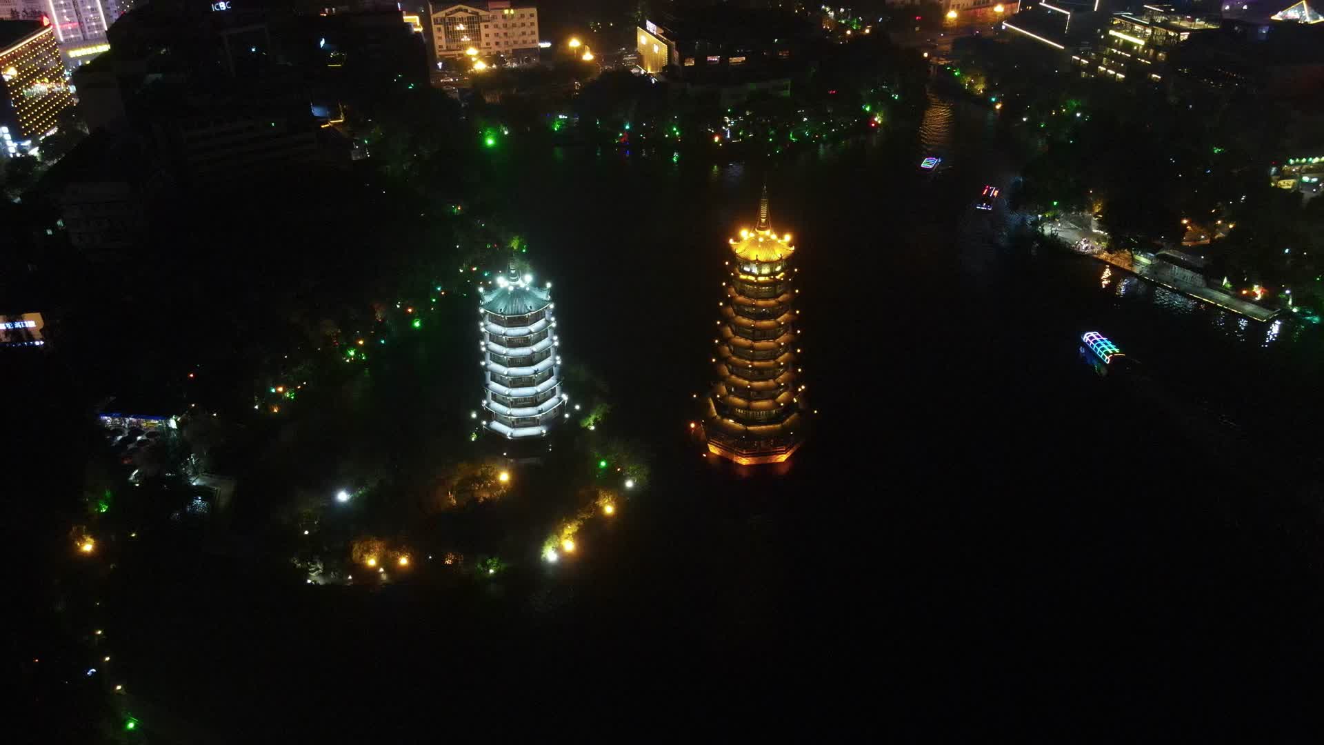 航拍广西桂林日月双塔地标建筑夜景视频的预览图