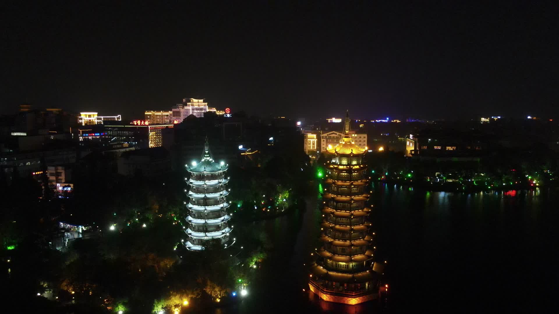 航拍广西桂林日月双塔地标建筑夜景灯光视频的预览图