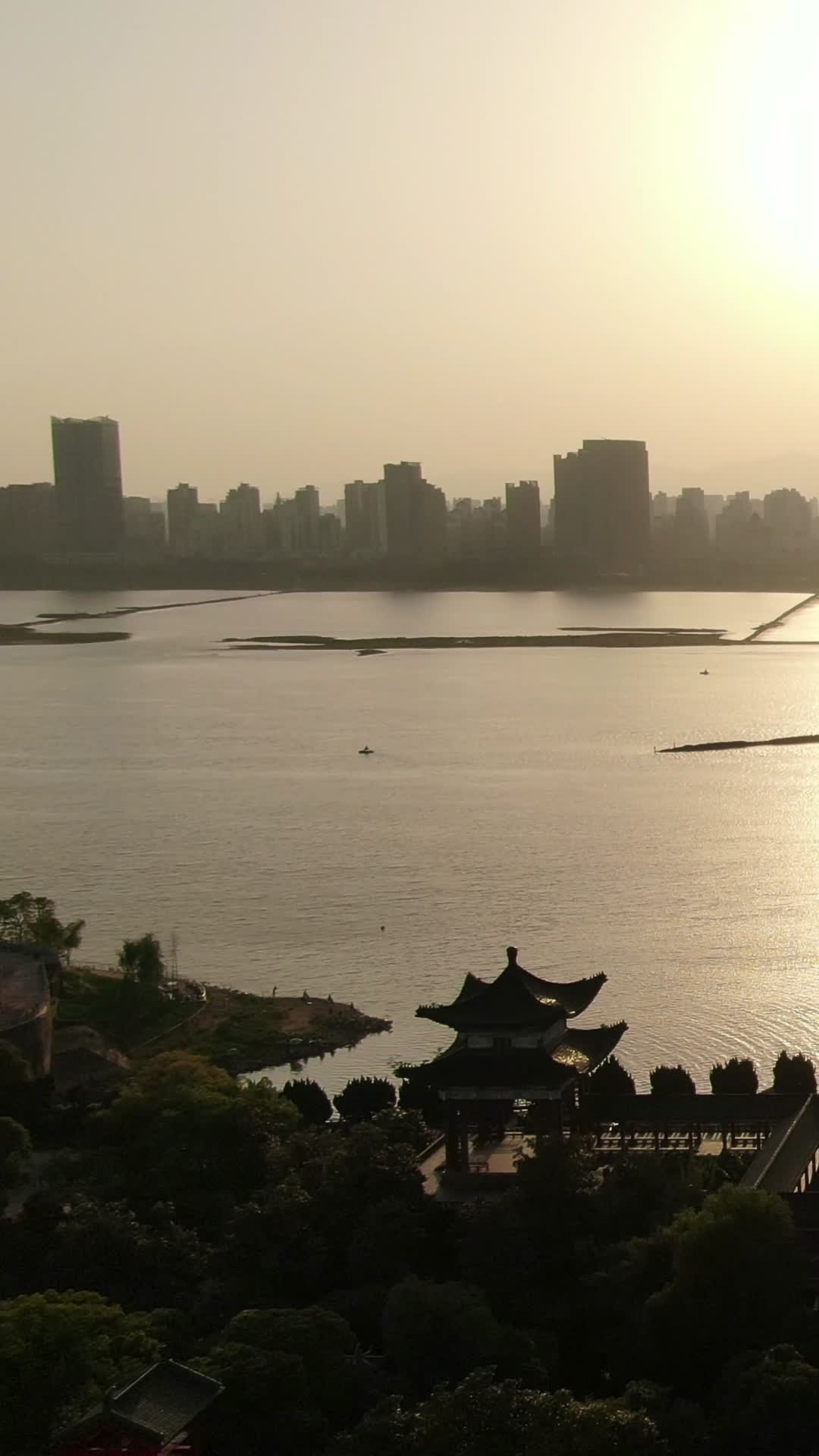 航拍江西南昌城市CBD日落晚霞竖屏视频视频的预览图