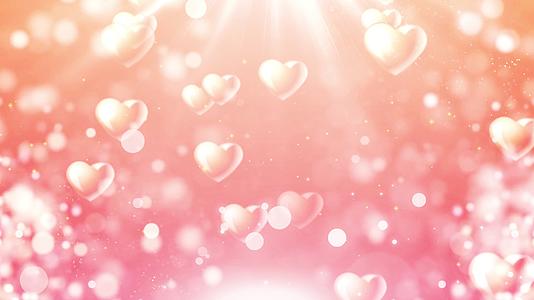 4K浪漫温馨粉色爱心粒子背景视频视频的预览图