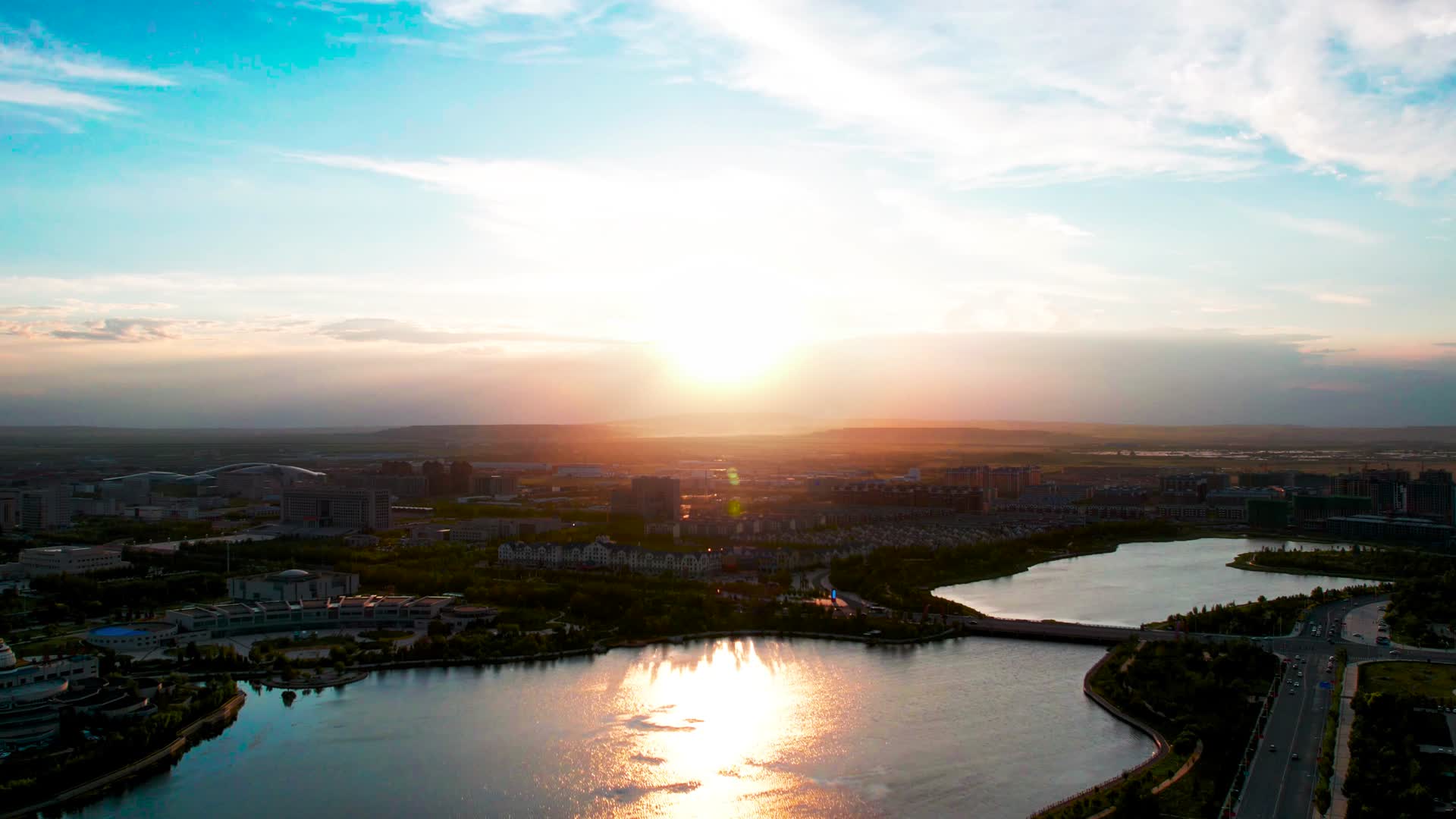 锡林浩特市锡林湖畔蓝天白云夕阳落日傍晚4k航拍延时视频视频的预览图