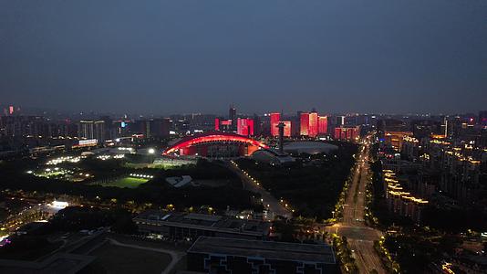 4K航拍南京城市地标奥体中心体育馆河西CBD夜景视频的预览图