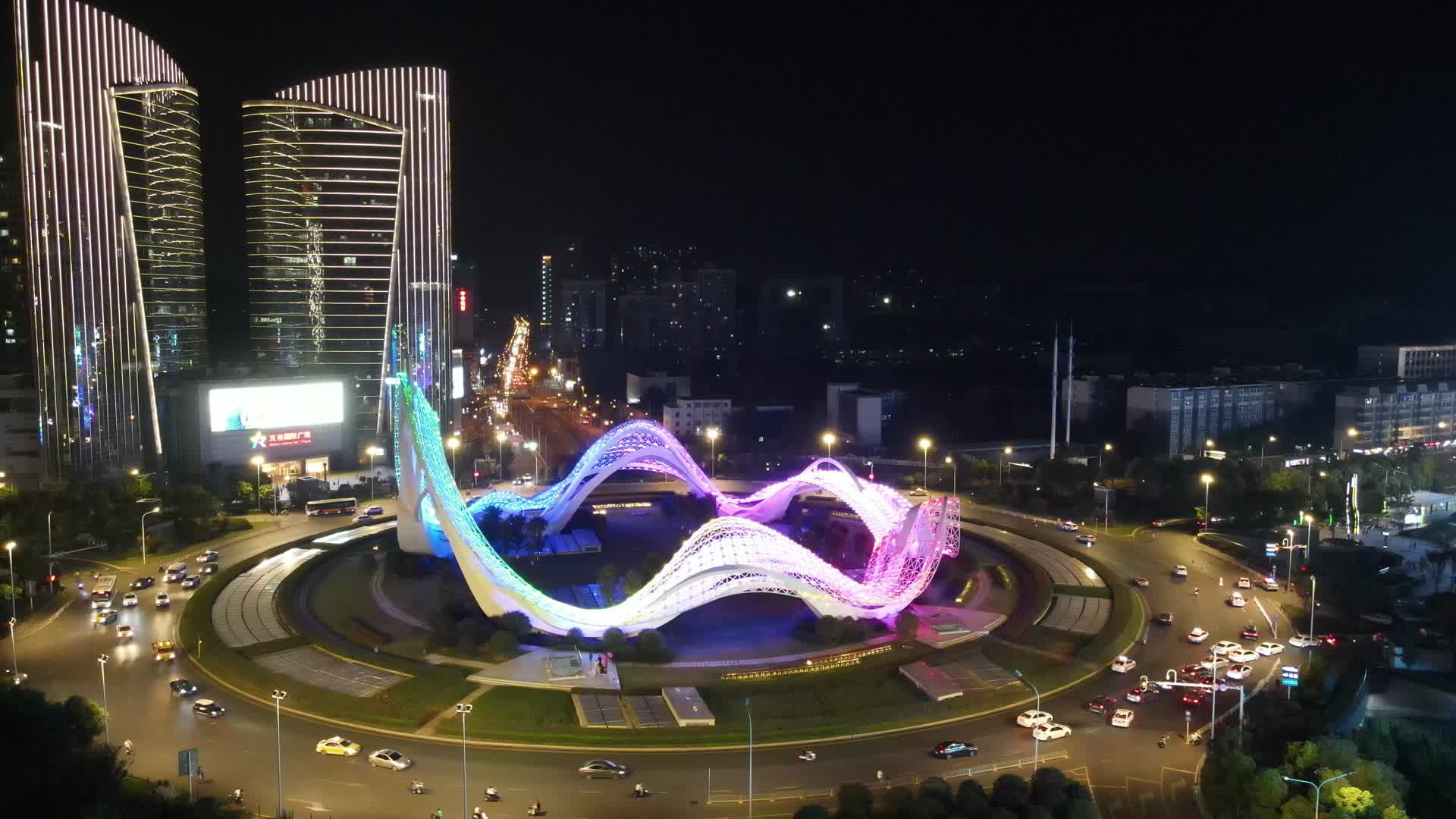 武汉地标光谷广场交通转盘交通夜景灯光航拍视频的预览图