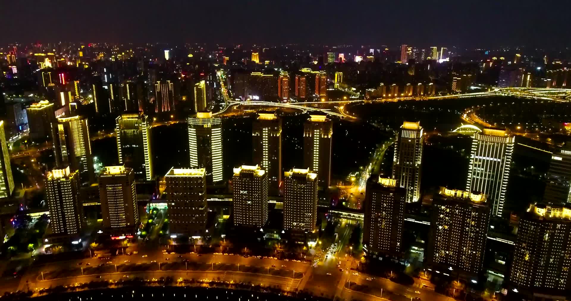 航拍郑州玉米楼附近城市建筑夜景视频的预览图