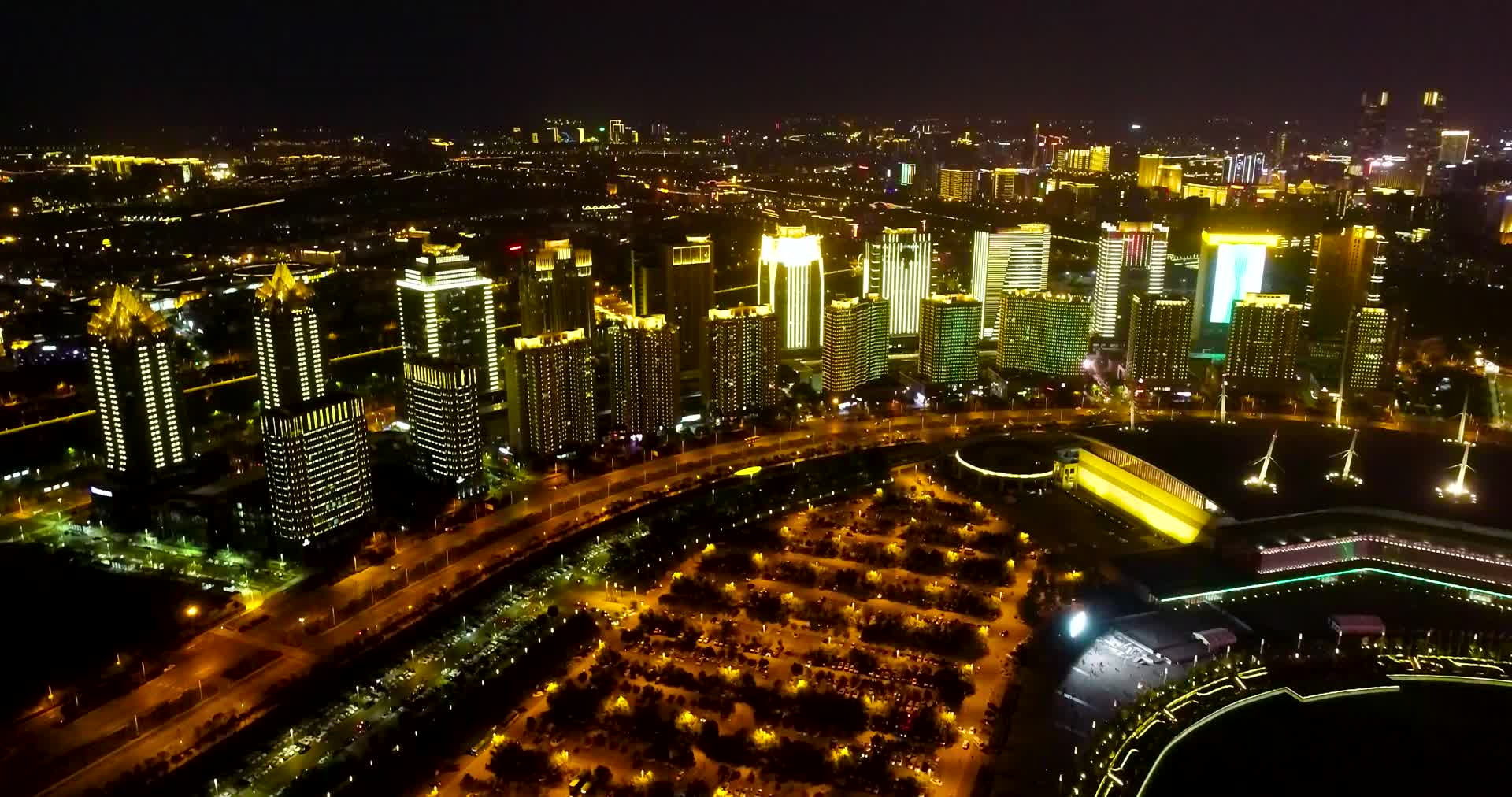 航拍郑州玉米楼唯美灯光秀城市夜景视频的预览图