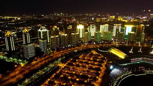 航拍郑州玉米楼唯美灯光秀城市夜景视频的预览图