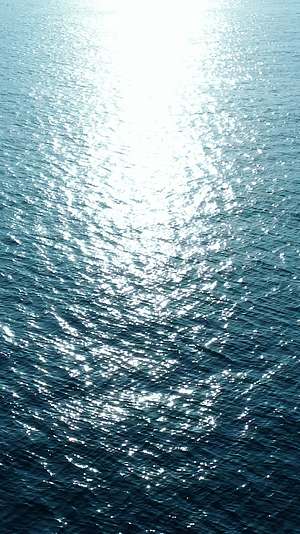 蓝色海面波澜左移方向日出风光4K航拍背景视频视频的预览图
