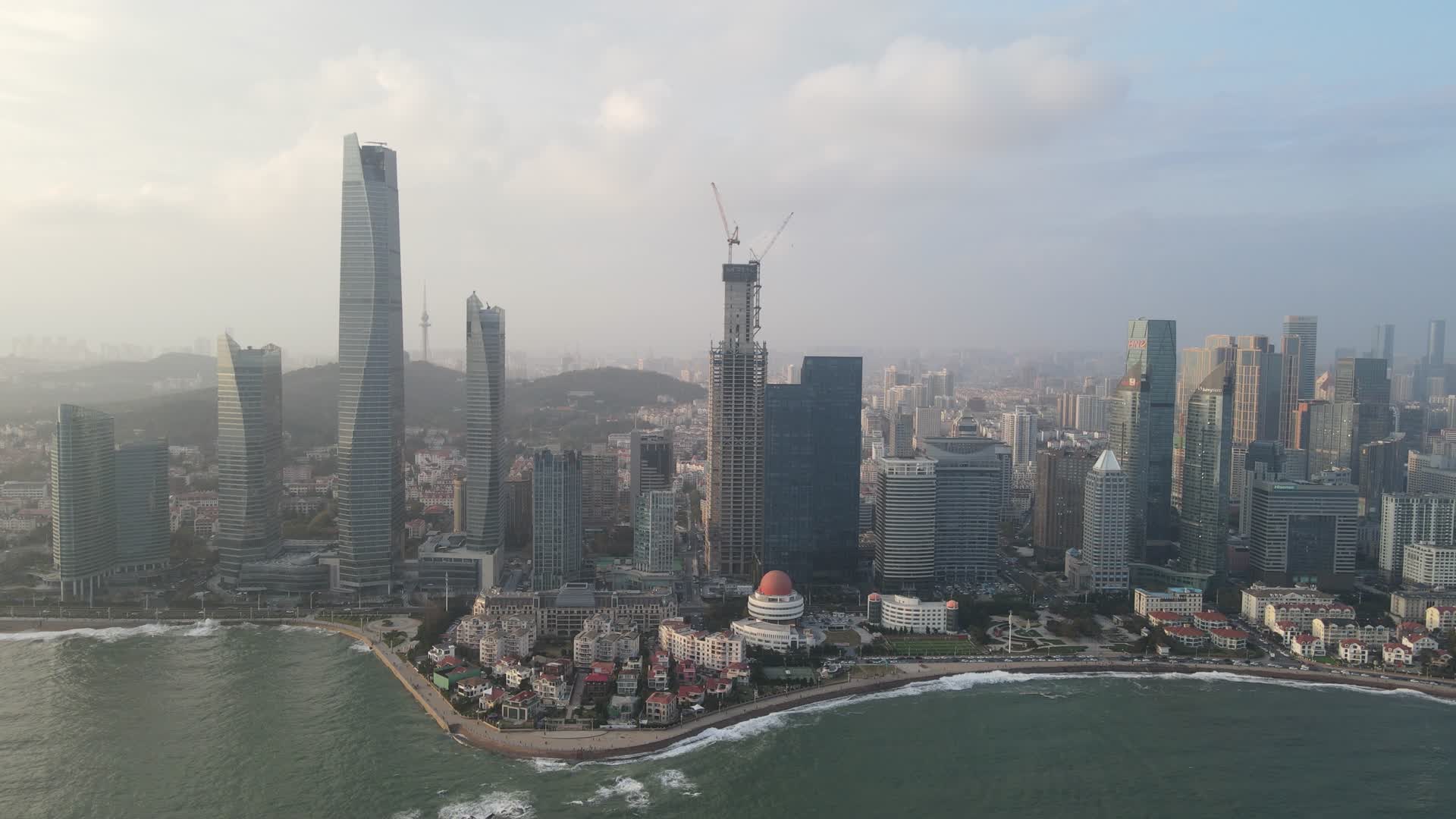 航拍山东青岛城市海岸线CBD商务建筑视频的预览图