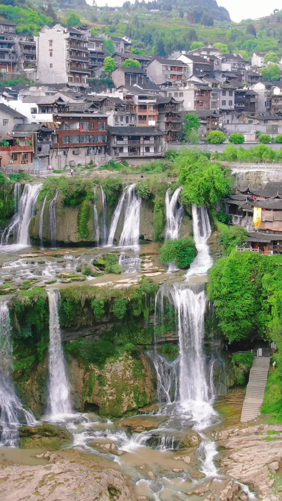 航拍湖南湘西芙蓉镇瀑布流水竖屏视频的预览图