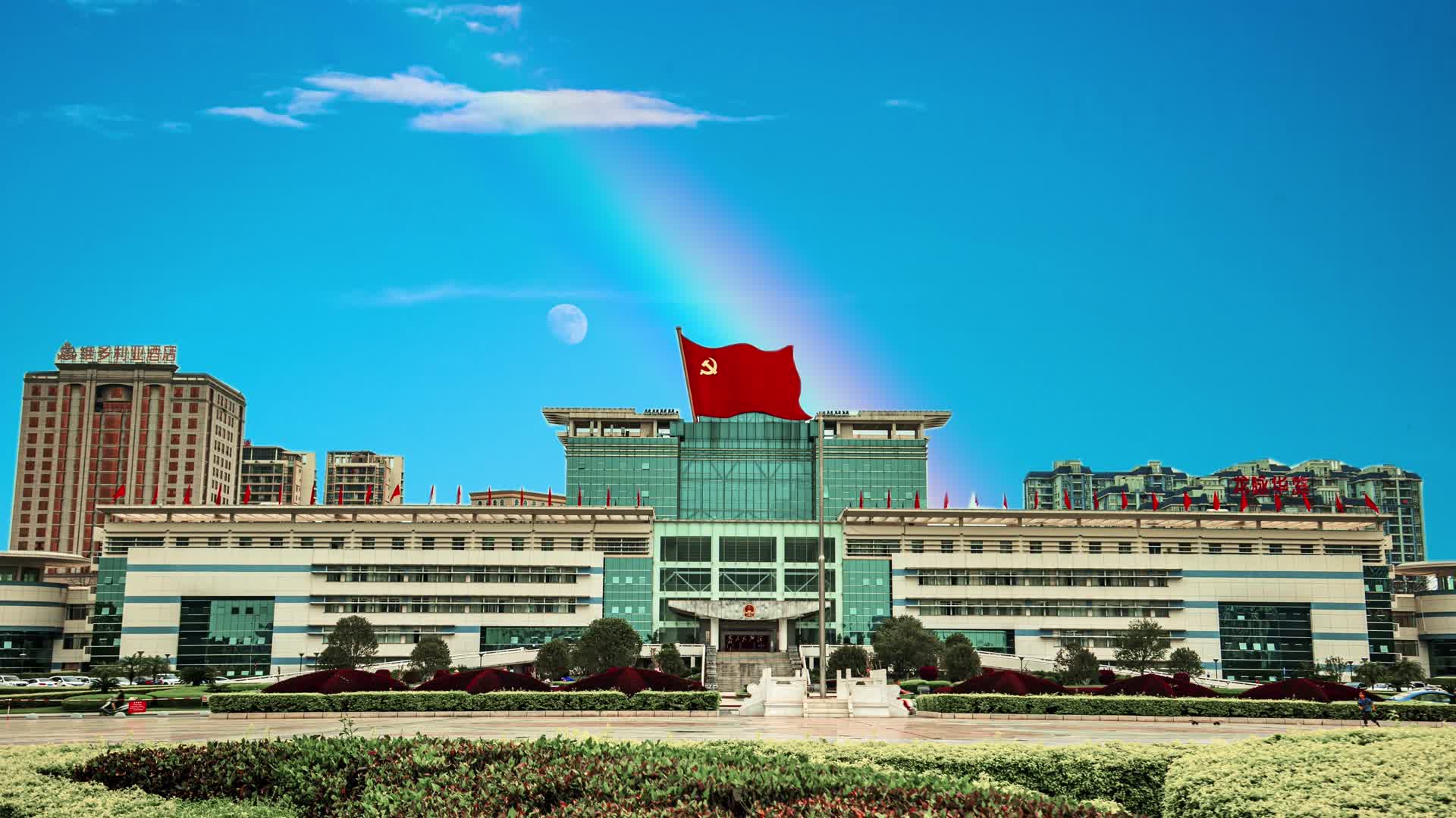 4k延时广西贵港政府大楼红旗飘扬合成视频的预览图