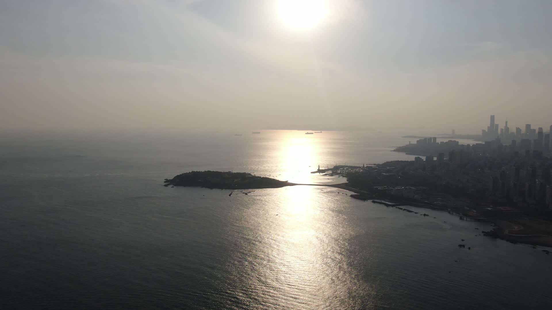航拍青岛城市建设日出日落视频的预览图