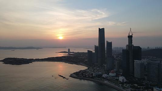 航拍青岛城市建设日出日落视频的预览图