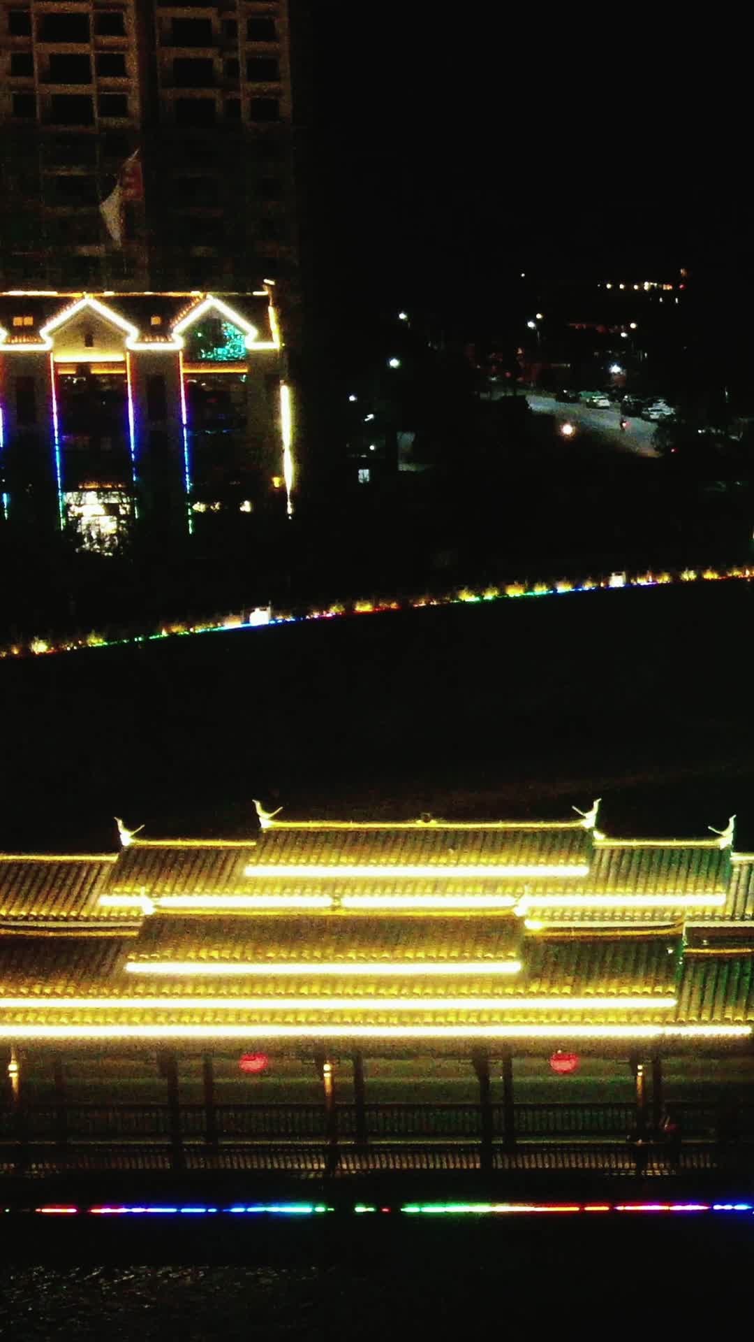 城市航拍侗族特色建筑风雨桥夜景竖屏视频的预览图
