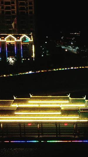 城市航拍侗族特色建筑风雨桥夜景竖屏视频的预览图