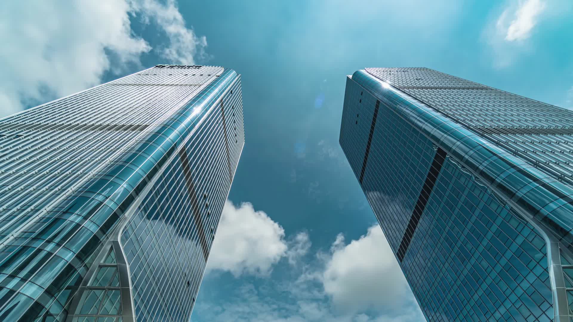 4k商务城市建筑写字楼蓝天白云延时商务楼视频的预览图