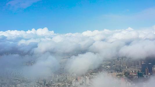 广东珠海城市上方云海云层穿云航拍风景视频的预览图