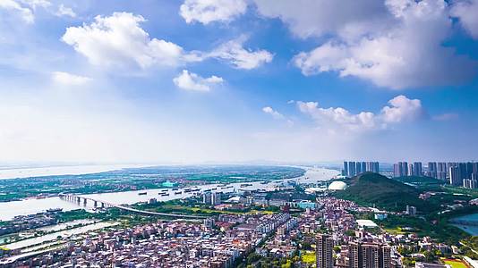 4K航拍广州番禺城乡结合部农村建设蓝天白云延时视频的预览图