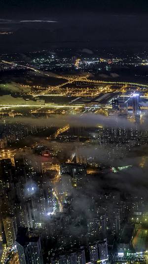 高清竖屏延时航拍南宁城市夜景云海之上视频的预览图