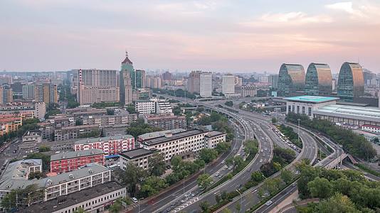 北京西直门桥凯德mall高峰段车水马龙日转夜延时视频视频的预览图