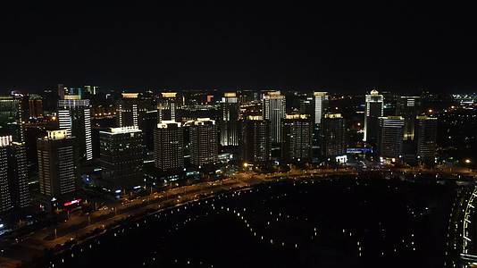 航拍河南郑州会展中心住宅楼夜景灯光视频的预览图