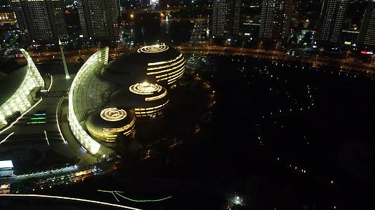 航拍河南郑州河南艺术馆夜景视频的预览图