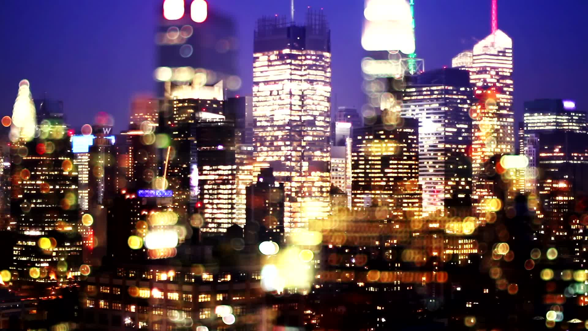 城市夜晚景色风景高楼大厦光晕万家灯火焦外虚化视频的预览图