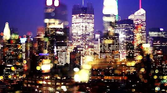 城市夜晚景色风景高楼大厦光晕万家灯火焦外虚化视频的预览图