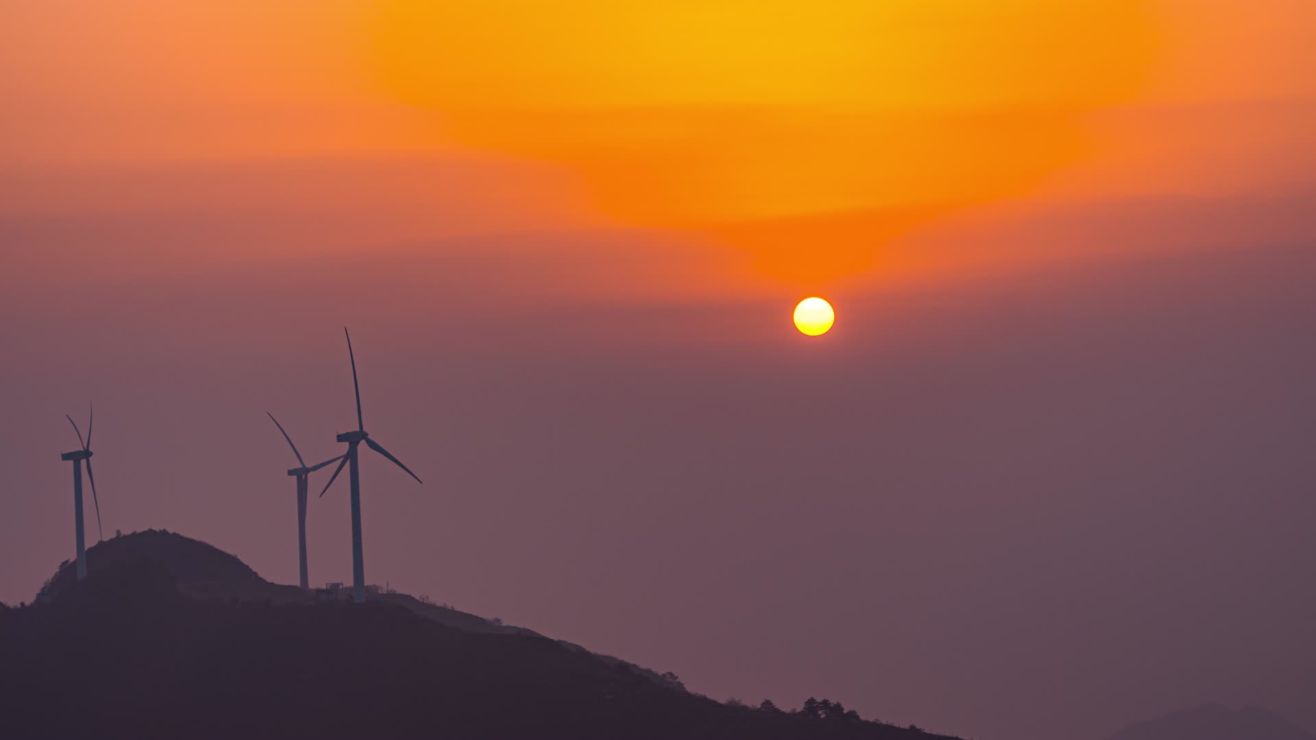 8K山峰朝霞风力发电日出东方能源延时视频的预览图