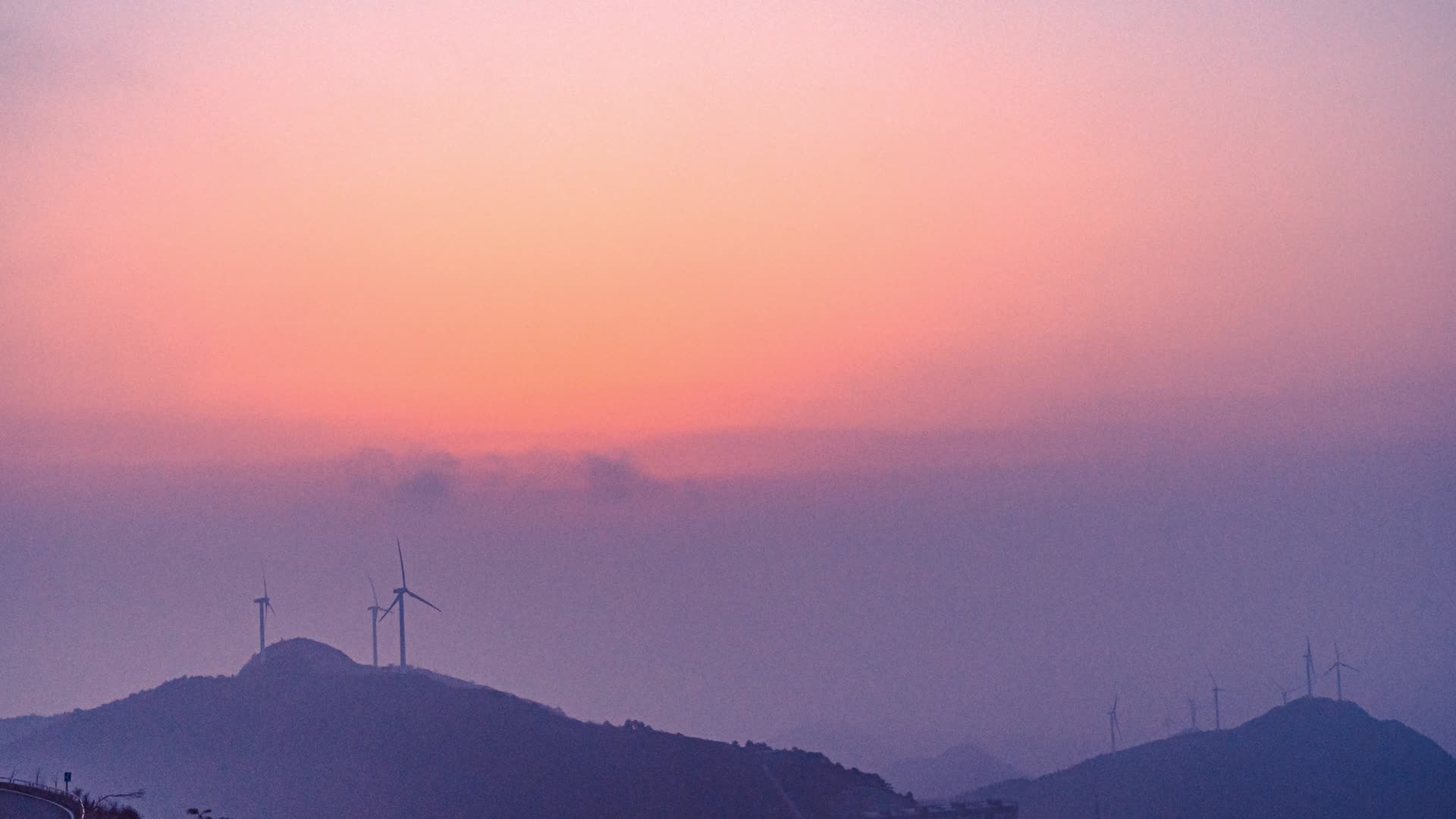 8K山峰山顶朝霞风力发电日出东方能源延时视频的预览图