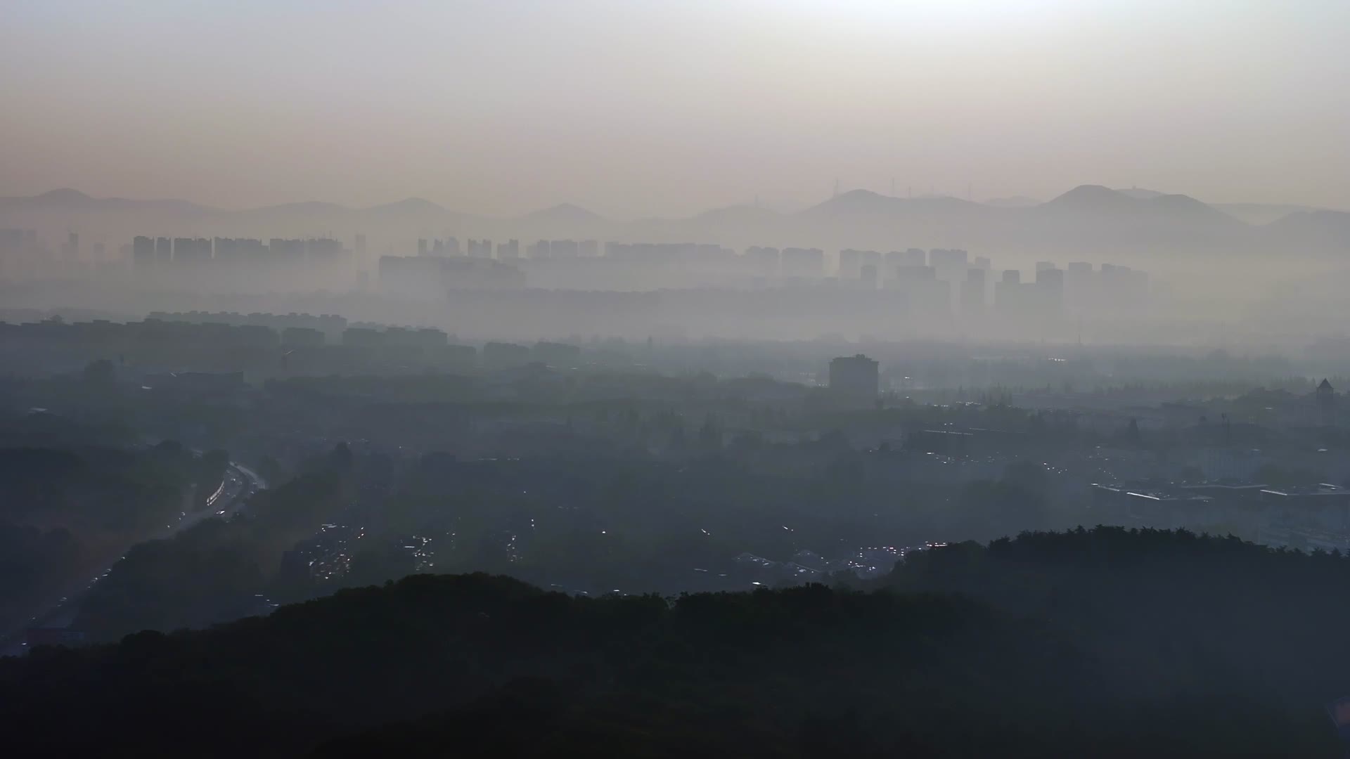 航拍南京城市风光日出特写长焦视频的预览图