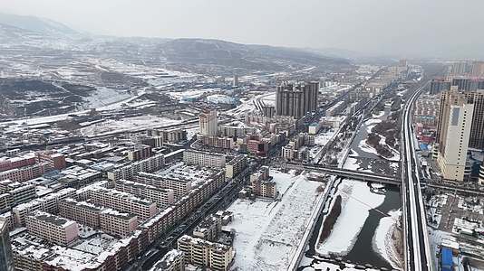 航拍青海西宁冬季大通雪景视频的预览图
